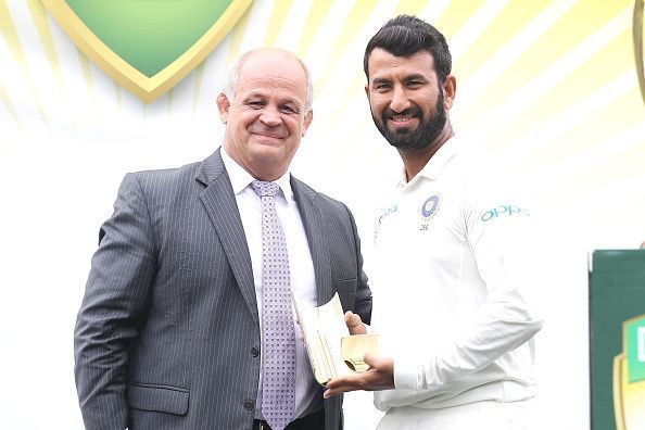 Pujara  (right) top scored in the first essay.