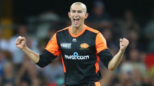 Ashton Agar celebrates a wicket against Brisbane Heat