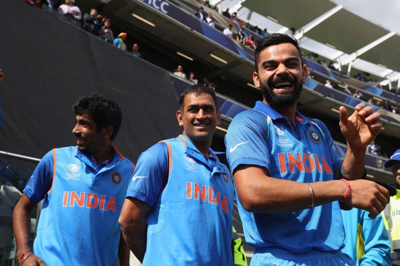 Jasprit Bumrah (left), MS Dhoni (center), Virat Kohli (right)