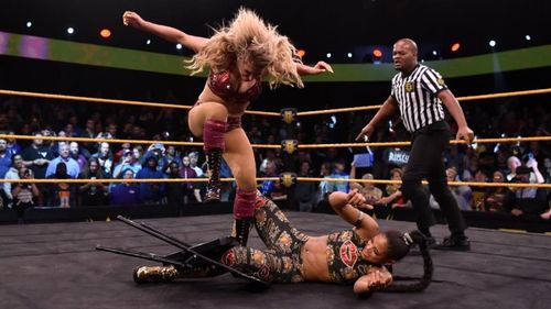 Charlotte Flair viciously attacking Bianca Belair