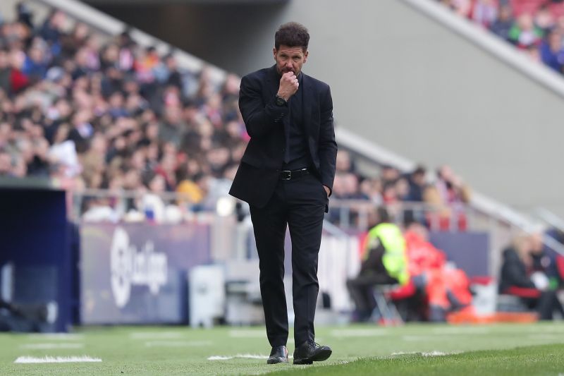 Simeone cautiously patrols his technical area.