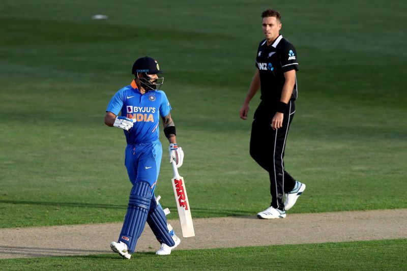 Virat Kohli walks back after being cleaned up by Tim Southee.