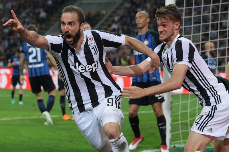Gonzalo Higuain (left) rejoices after scoring a late winner at the San Siro
