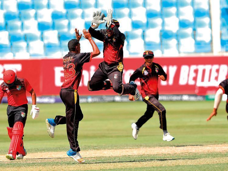 Papua New Guinea celebrate against Singapore.