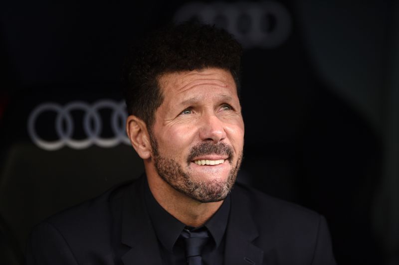 Diego Simeone watches on as his side lose to rivals Real Madrid.