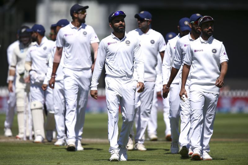 A dejected Indian team walks back after their juggernaut finally ground to a halt in Wellington.