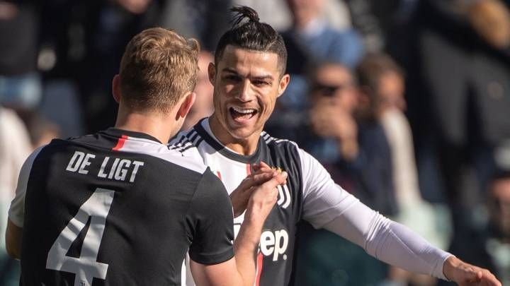 Ronaldo (right) celebrates after scoring one of his two penalties against Fiorentina