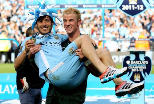 Manchester City celebrate after winning at QPR on the final day of teh 2011-12 season