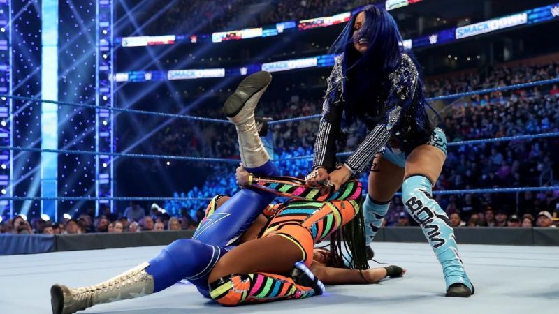 Sasha caused the match to end in DQ