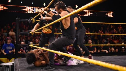 The Undisputed Era beating down Velveteen Dream