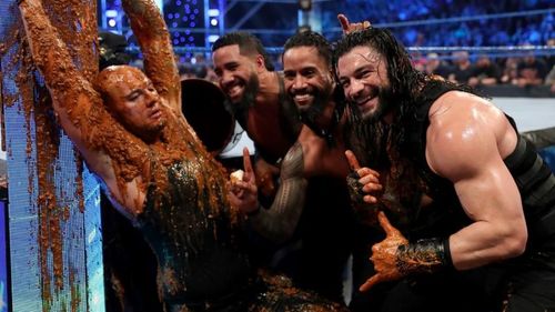 Roman Reigns and The Usos slathered dog food all over King Corbin!