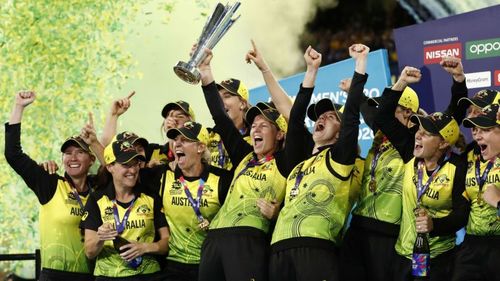 Australia celebrate with the trophy after