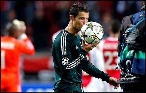 Ronaldo takes the match ball after scoring his first Champions League hat-trick in 2012.