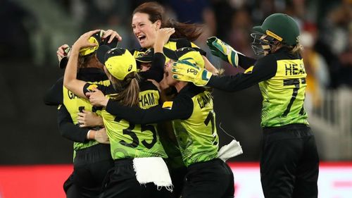 Australia celebrate after wrapping up victory over India at the MCG.