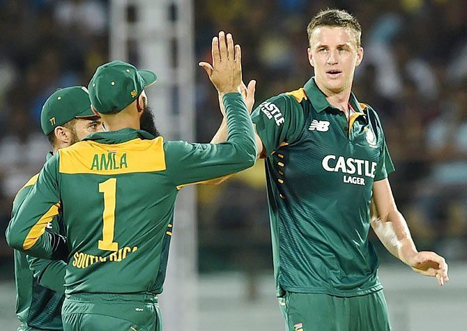 Morne Morket (right) grabbed late wickets to derail India's chase in Rajkot.