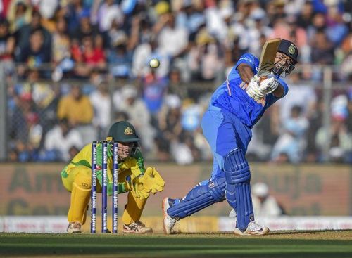 A One Day International match between India (blue) and Australia.