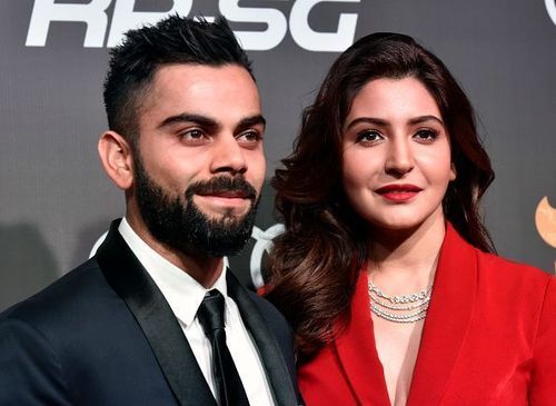 Virat Kohli (left) with wife Anushka Sharma (right)