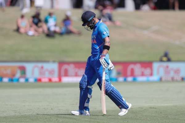 A desolate Kohli walks back after his dismissal