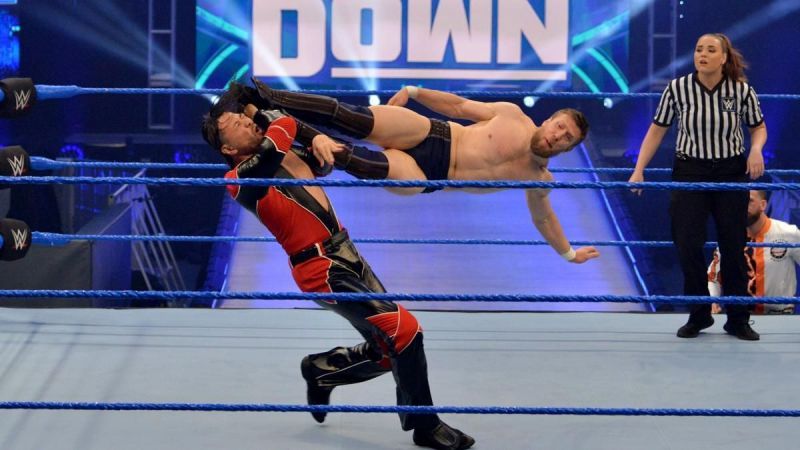 Daniel Bryan nailing Nakamura with a dropkick