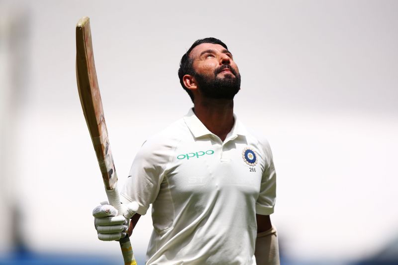 Cheteshwar Pujara celebrates a milestone