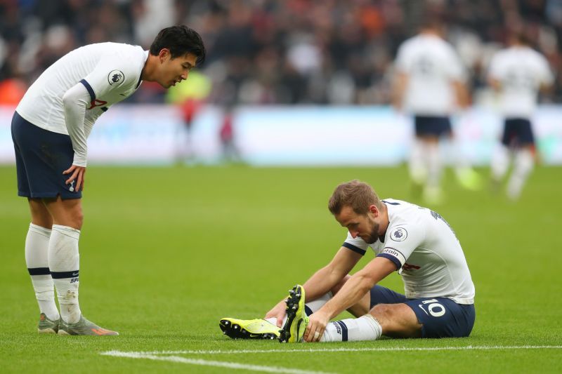 Harry Kane lies injured during a Premier League game against West Ham United.