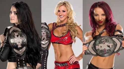 The first three NXT Women's Champions: Paige, Charlotte Flair, and Sasha Banks