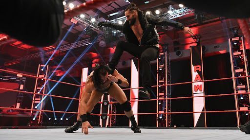 Seth Rollins attacking Drew McIntyre on RAW