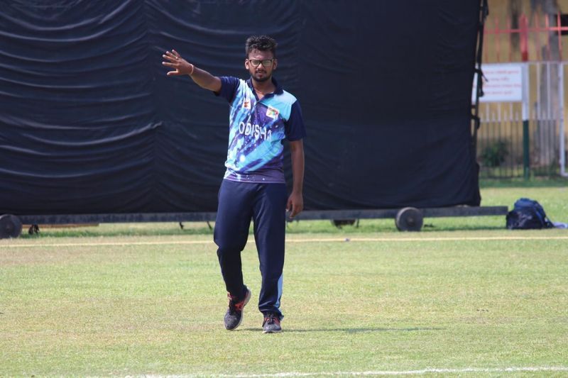 Ray setting the field during a leg cricket match