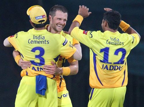 Dirk Nannes celebrates Sachin Tendulkar's wicket with Suresh Raina (L) and Ravindra Jadeja (R)