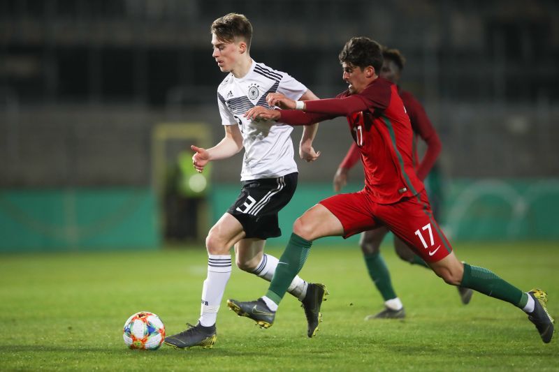 Francisco Trincao challenging for the ball.