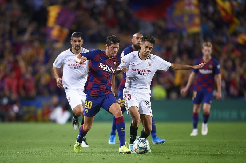 Sergio Reguilon (right) tussles it out with Sergi Roberto.