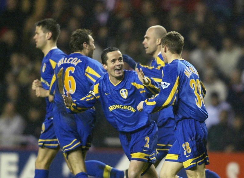 James Milner celebrates with his Leeds teammates after breaking the Premier League record