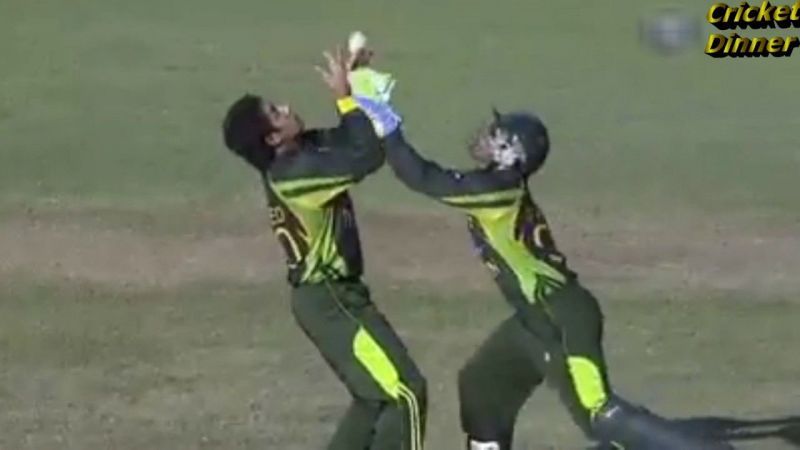 Umar Akmal and Saeed Ajmal going for the same catch