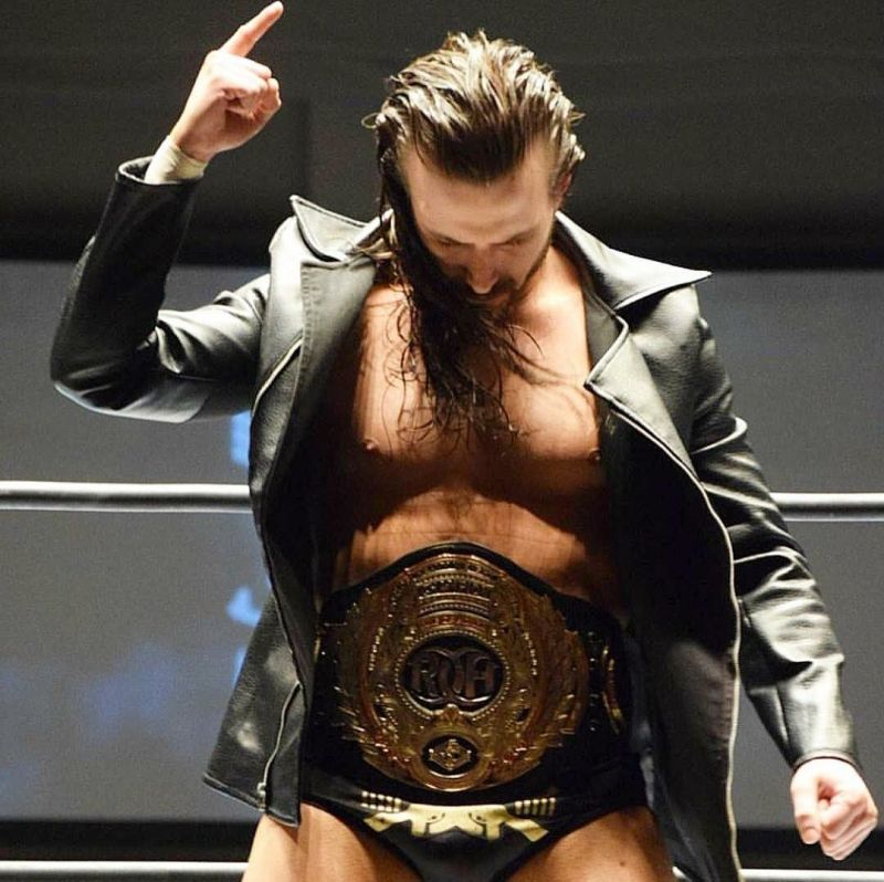 Adam Cole with the traditional Bullet Club leather jacket