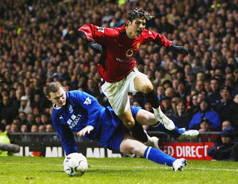 Cristiano Ronaldo skips past Wayne Rooney, who would later go on to become his teammate