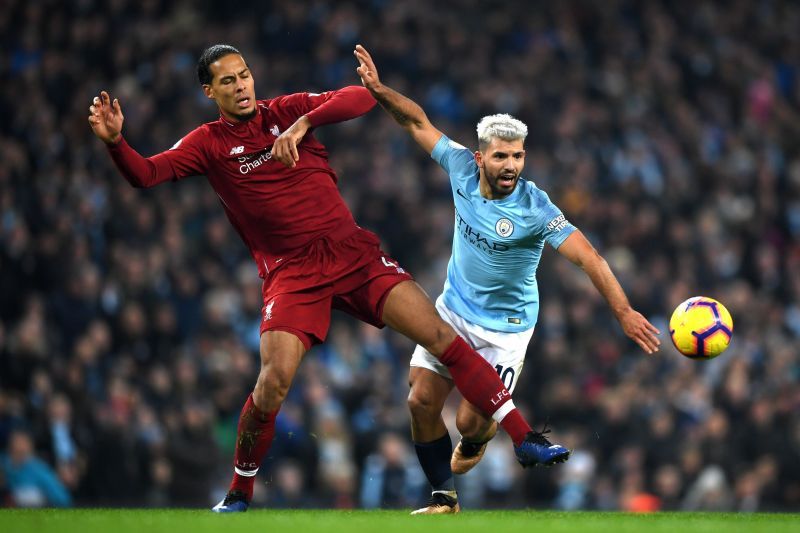 Virgil van Dijk defenders the ball from Sergio Aguero in the Premier League