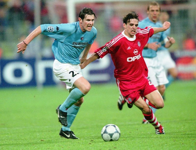 Owen Hargreaves dribbles past Brett Emerton