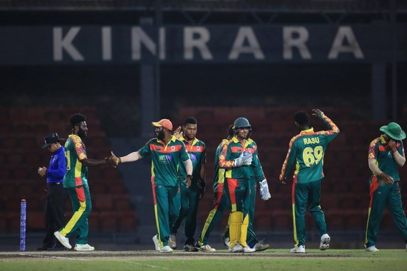 Members of the Vanuatu national team celebrate a wicket