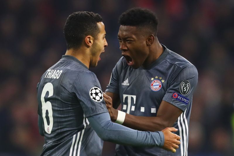 David Alaba celebrates a goal with Thiago