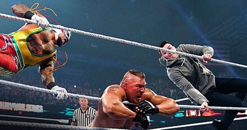 Rey Mysterio and Dominick delivering a double 619 on Brock Lesnar at Survivor Series.