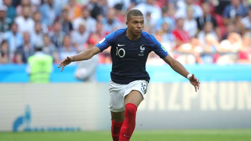 Kylian Mbappe celebrates scoring against Lionel Messi's Argentina