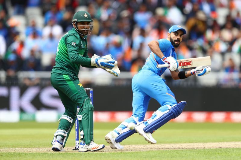 Pakistan wicketkeeper Sarfaraz Ahmed (left) in action against India.