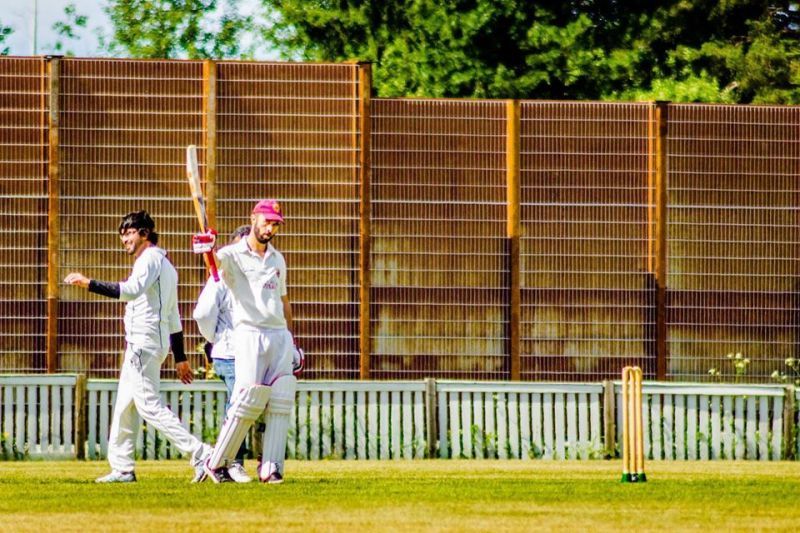 Nathan Collins raising his bat (Image credit: Cricket Finland on Facebook)