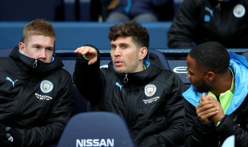 John Stones (middle) could reunite with Mikel Arteta at Arsenal next season