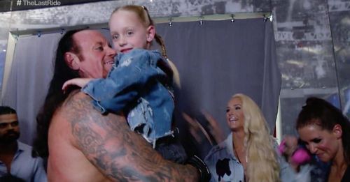 The Undertaker backstage with his daughter