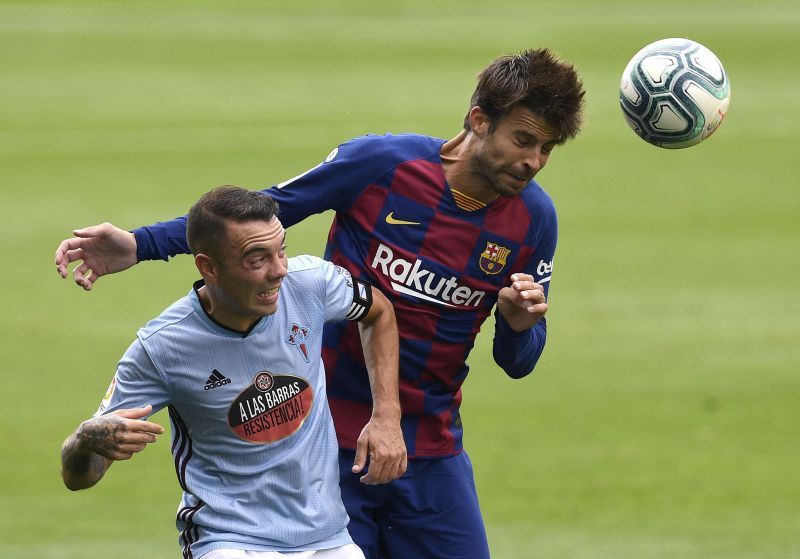 Gerard Pique and the scorer of the late equaliser, Iago Aspas