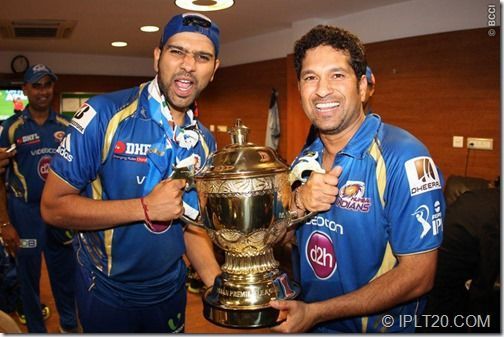 Rohit Sharma and Sachin Tendulkar with their first IPL trophy in 2013.