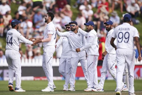 Ishant Sharma (centre) celebrates picking up a wicket.