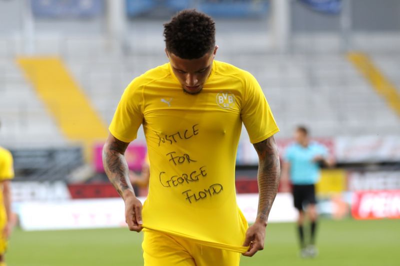 Sancho displays his 'Justice for George Floyd' t-shirt after his first goal on Sunday