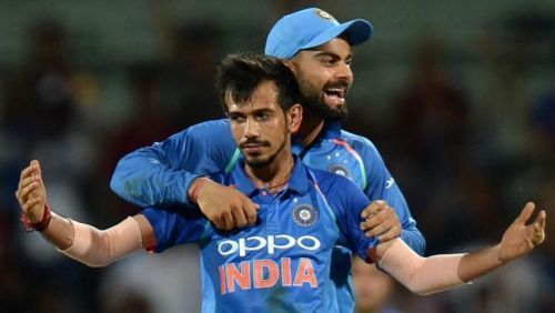 Yuzvendra Chahal celebrating with skipper Virat Kohli after taking a wicket